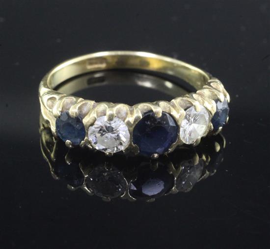 An 18ct gold, sapphire and diamond five stone half hoop ring, size Q.